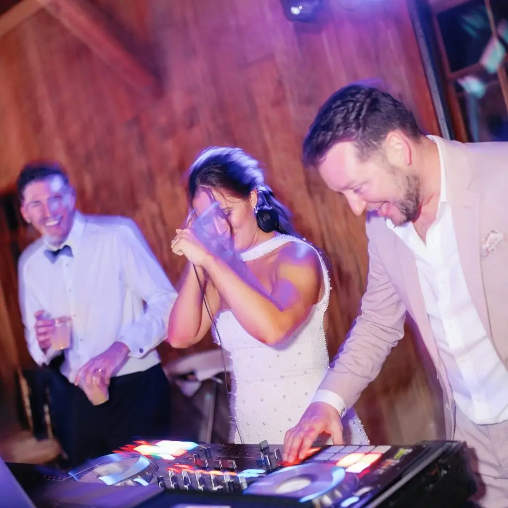 Bride and groom dancing and laughing with guests at Charleston wedding reception by ML Event Entertainment