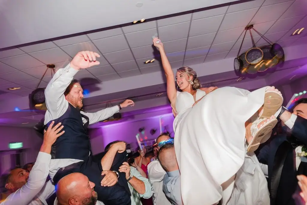 Bride lifted on the dancefloor at Charleston wedding with DJ by ML Event Entertainment