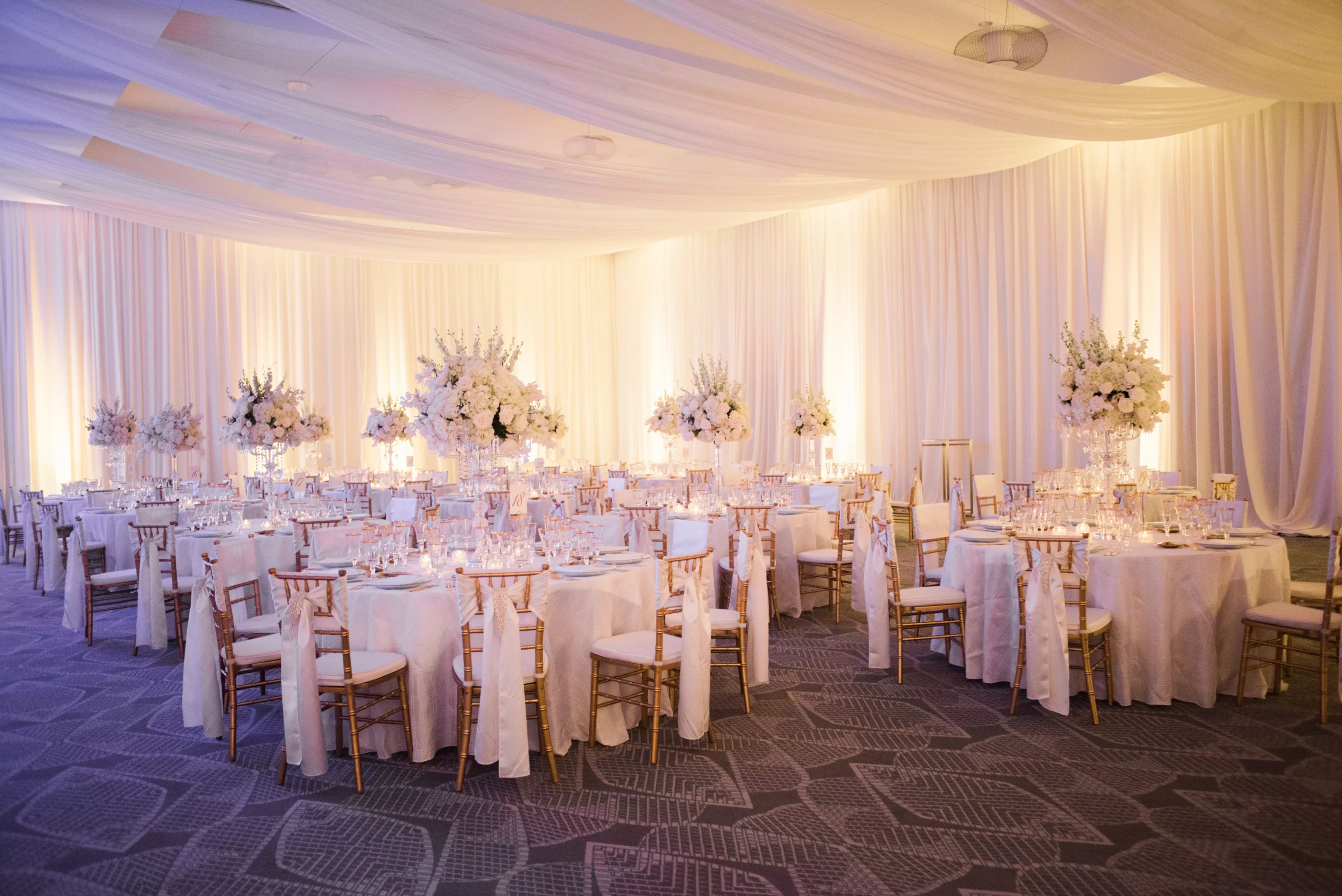 Elegant reception ballroom with uplighting